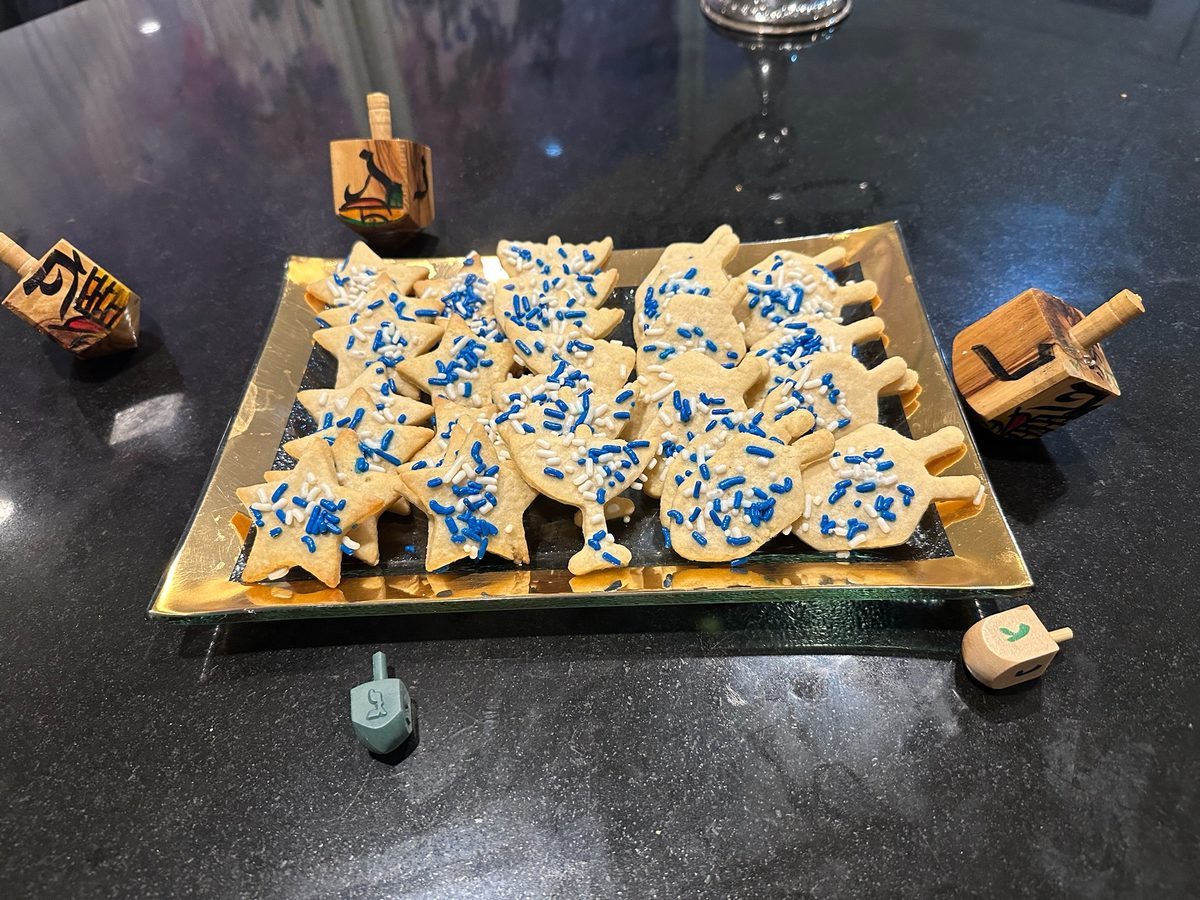 Hanukkah sugar cookie platter with stars, dreidels, and menorahs